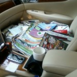 Kathy loads car with aged catalogs