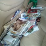 Kathy loads car with aged catalogs